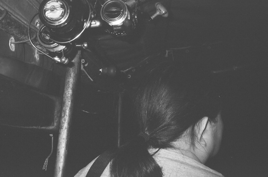 Female camera operator adjusting a broadcast television camera